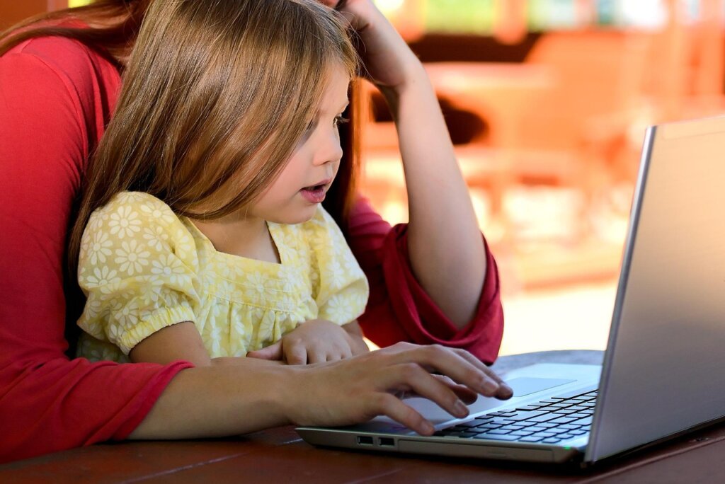 elderly korean parents checking health insurance refund on laptop at home