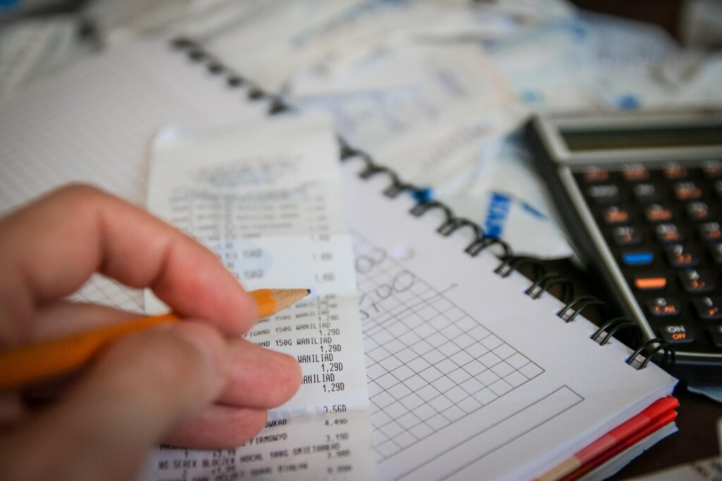 korean family saving money at home with calculator