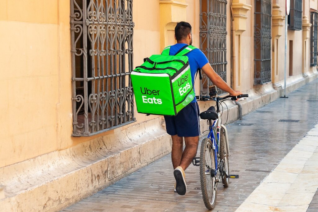 food delivery rider on street in Korean city