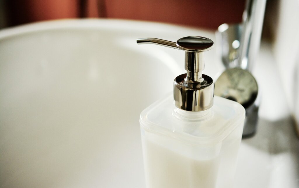 organized kitchen cleaning supplies baking soda dish soap spray bottle on counter
