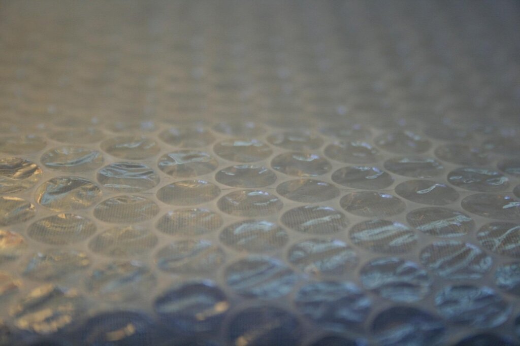 different types of window insulation bubble wrap products on a table