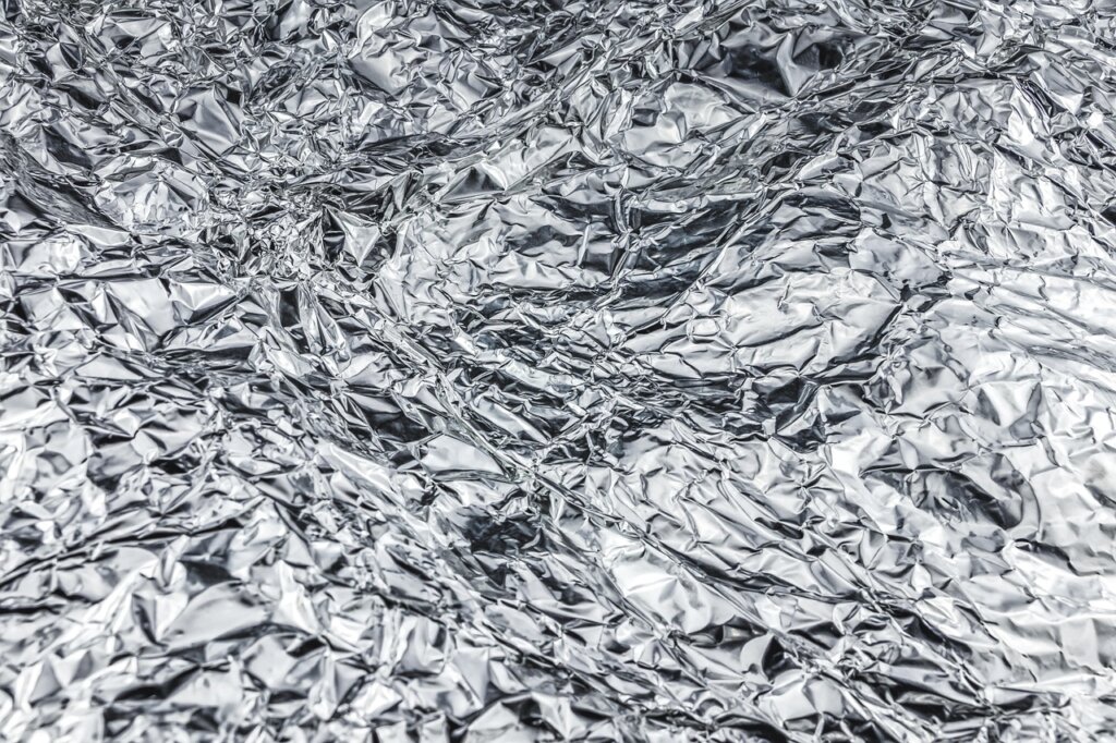 mixed material food container with foil lid separated