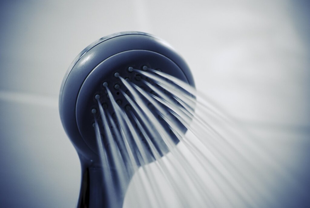before and after comparison of showerhead water pressure, weak trickle vs strong spray