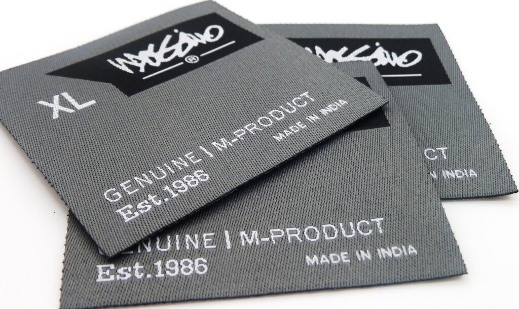 clothing care label tags showing fabric type symbols