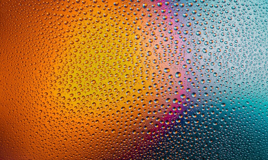 refrigerator vegetable drawer with condensation droplets on surface