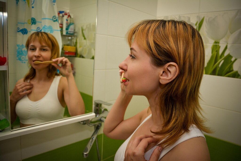 clear bathroom mirror reflection showing morning routine