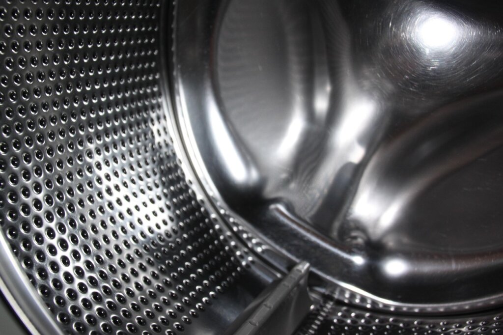 washing machine drum with black mold residue