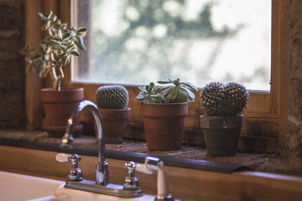 clean kitchen gloves hanging neatly on hook near sink