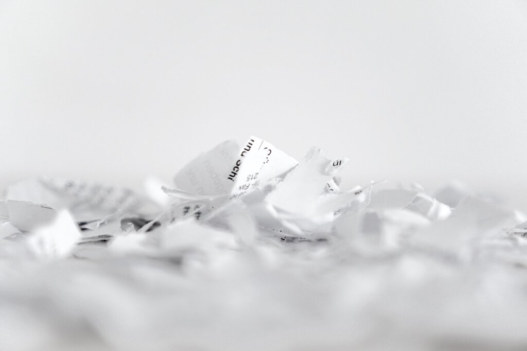 small paper shredder with receipts being shredded