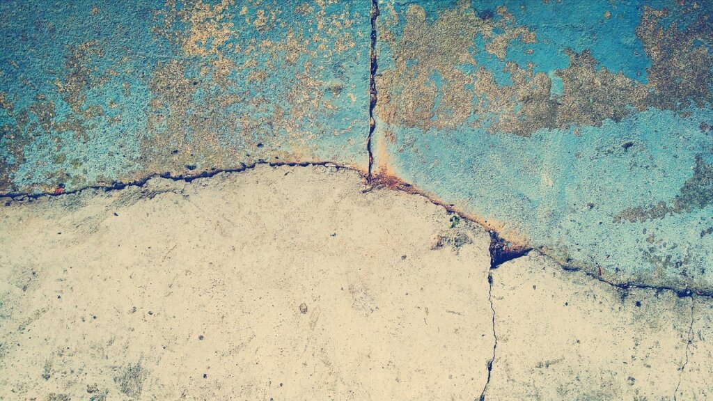 concrete crack being filled with elastic waterproof material